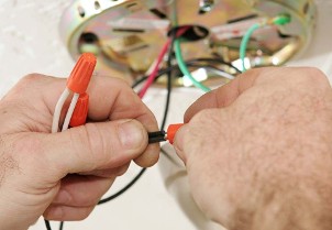 Person Working on Wires 